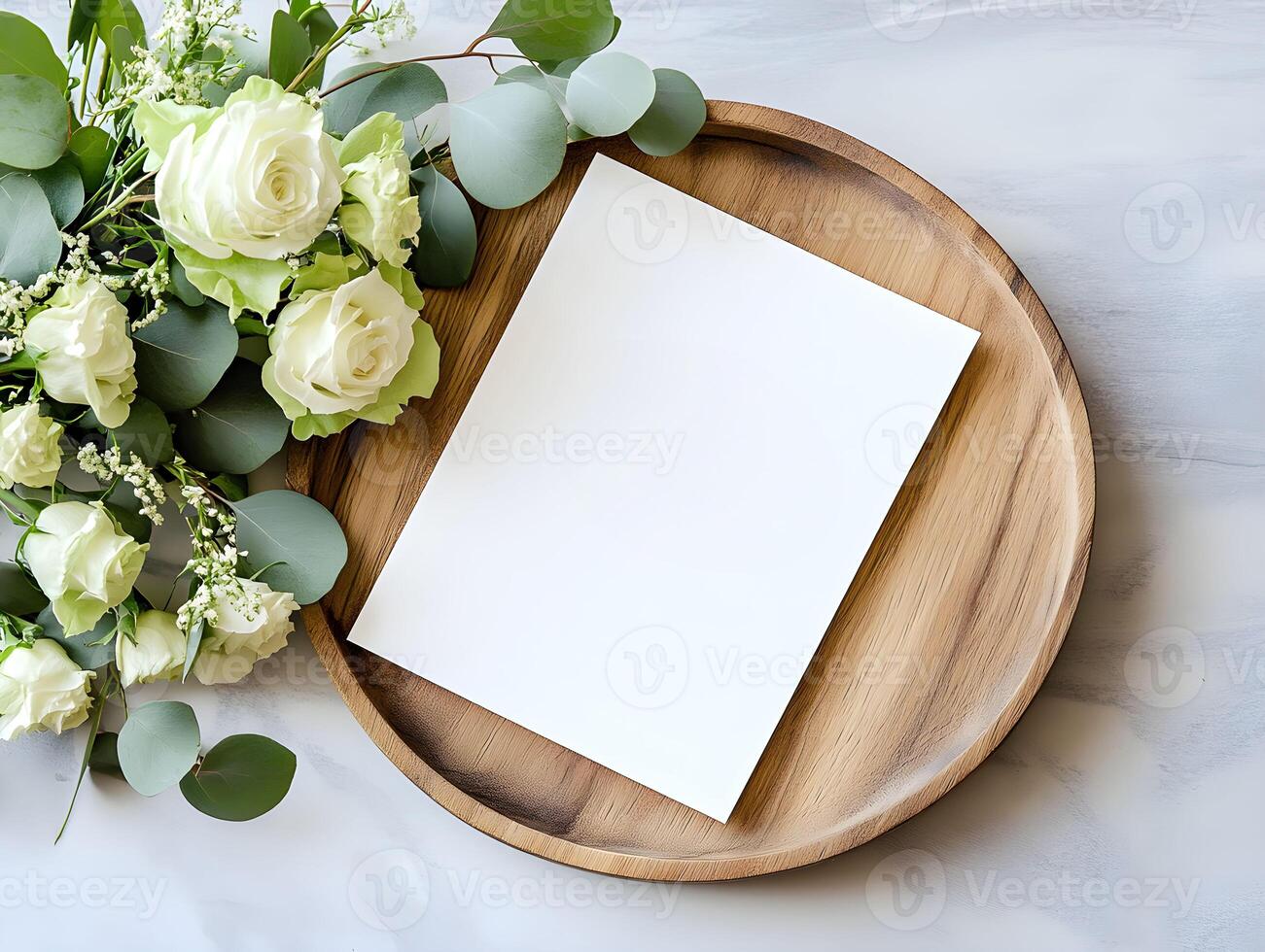 Elegant arrangement of fresh flowers and blank stationery for mockup on a wooden tray for invitations or personal notes in soft natural lighting photo