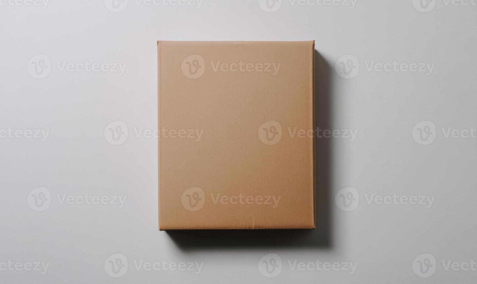 A brown cardboard box on a white surface photo