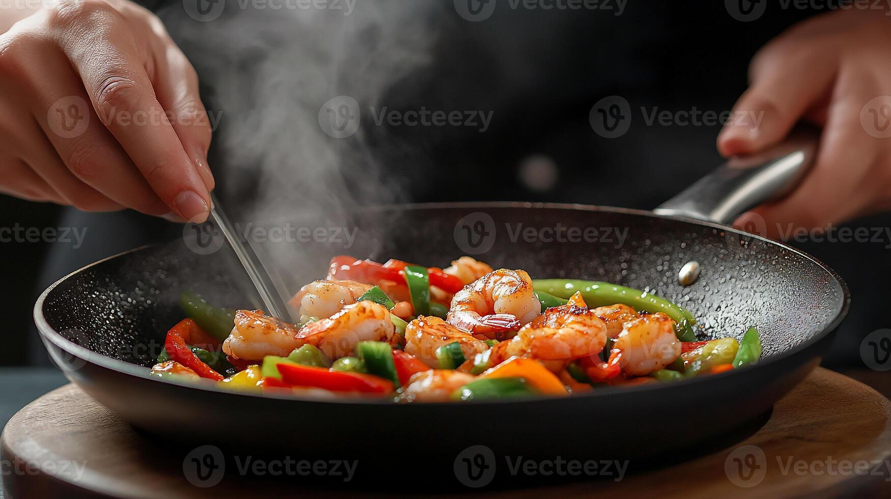 Chef stir-frying shrimp and vegetables in a pan photo