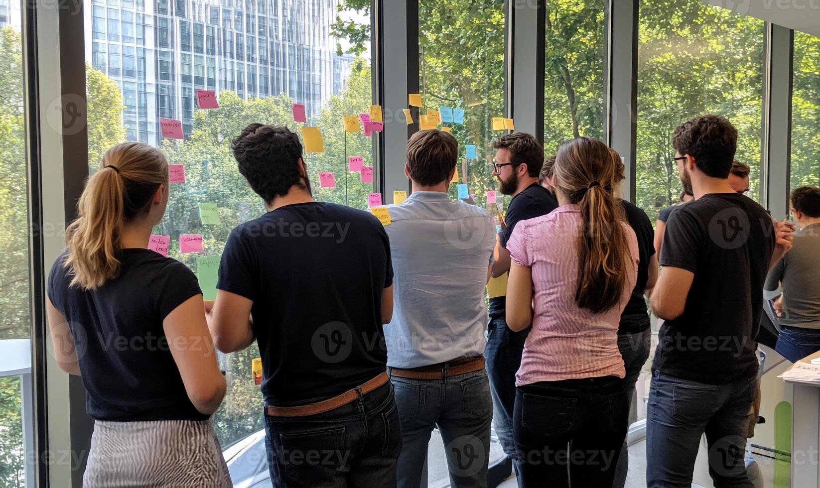 Brainstorming session by window overlooking city photo