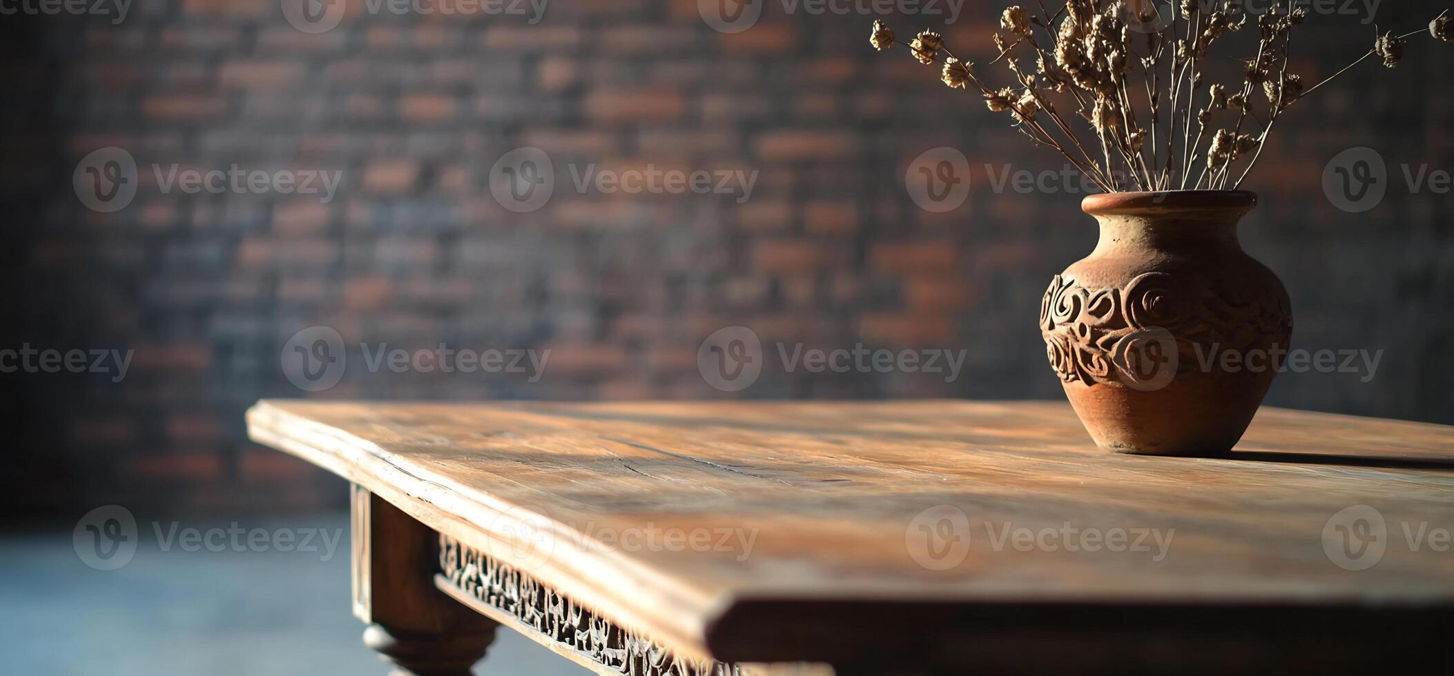 Dried Flowers in Terracotta Vase on Wooden Table photo