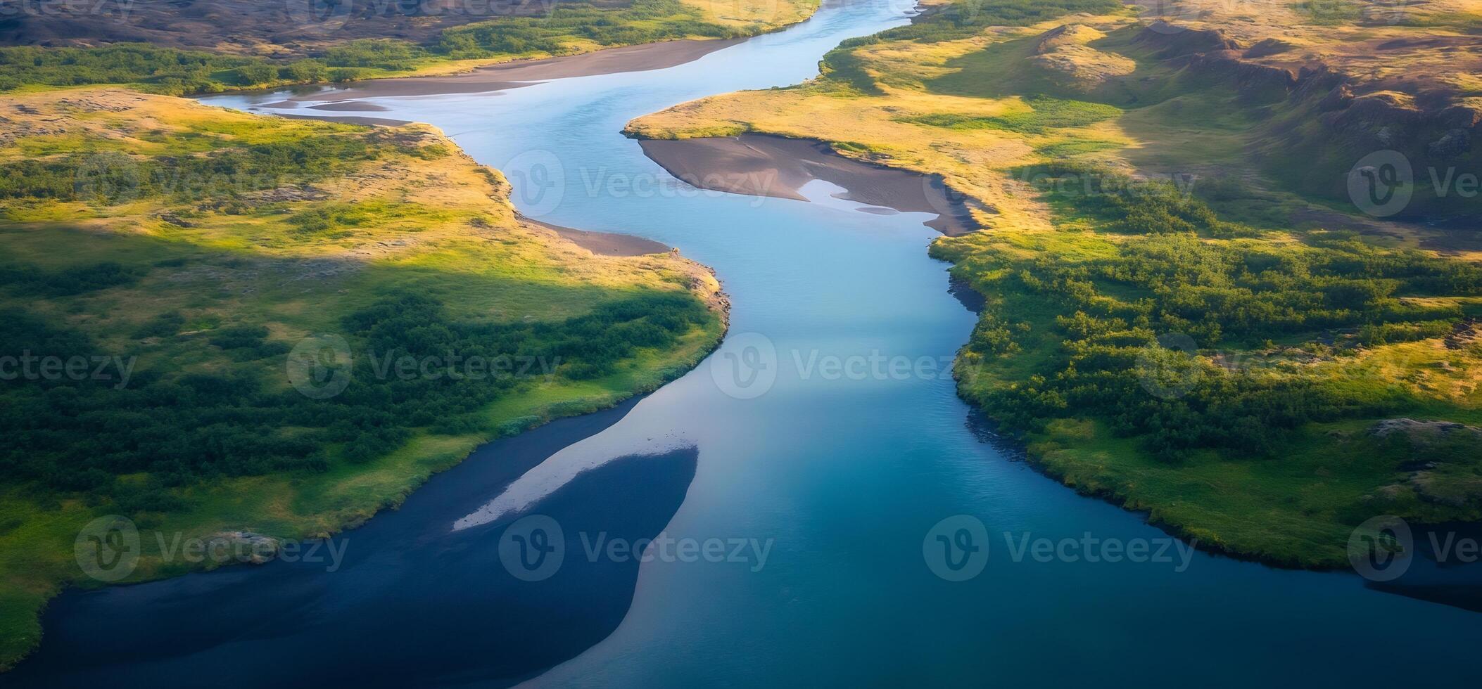 An aerial view of a river flowing through a valley photo