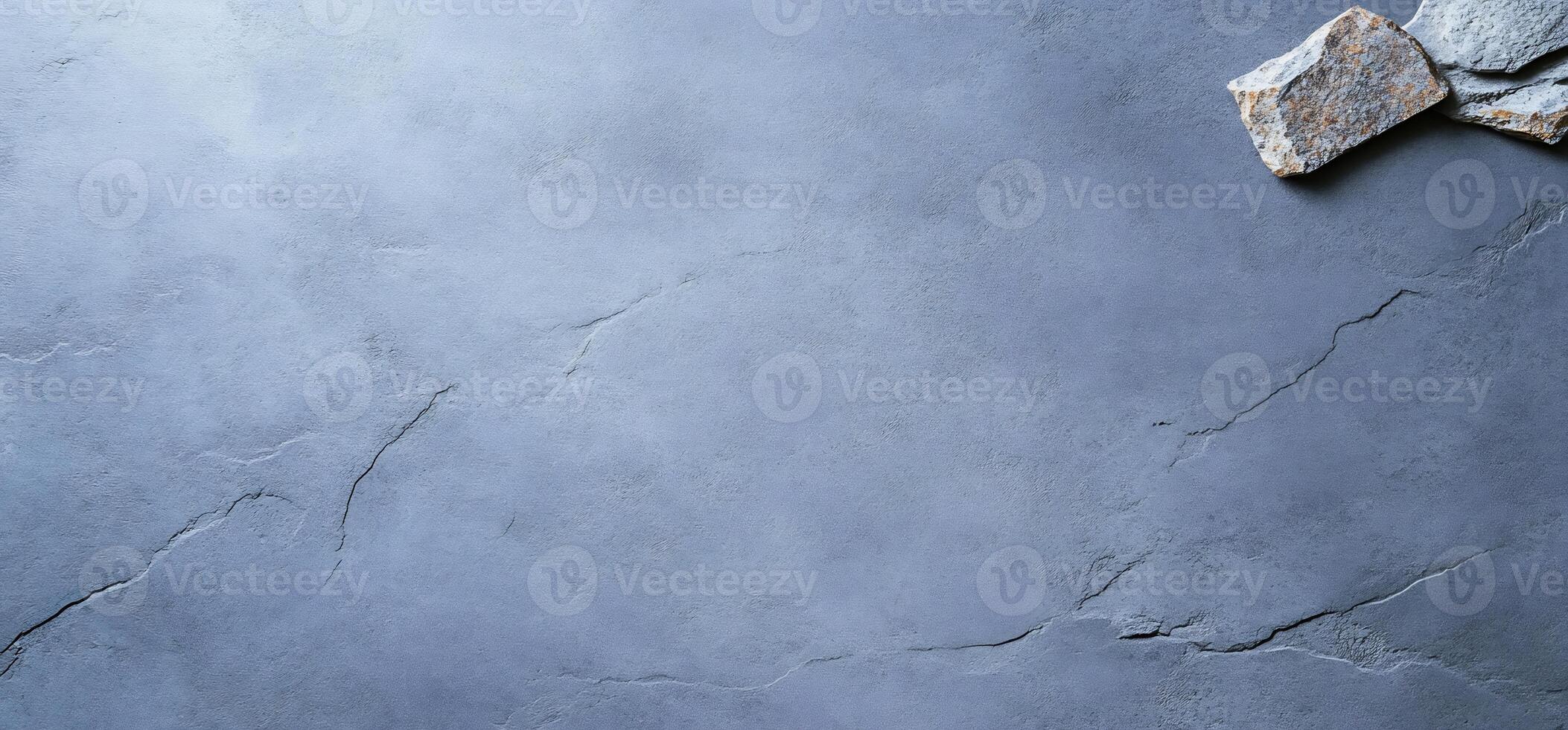 Gray stone surface with natural cracks and stones. photo