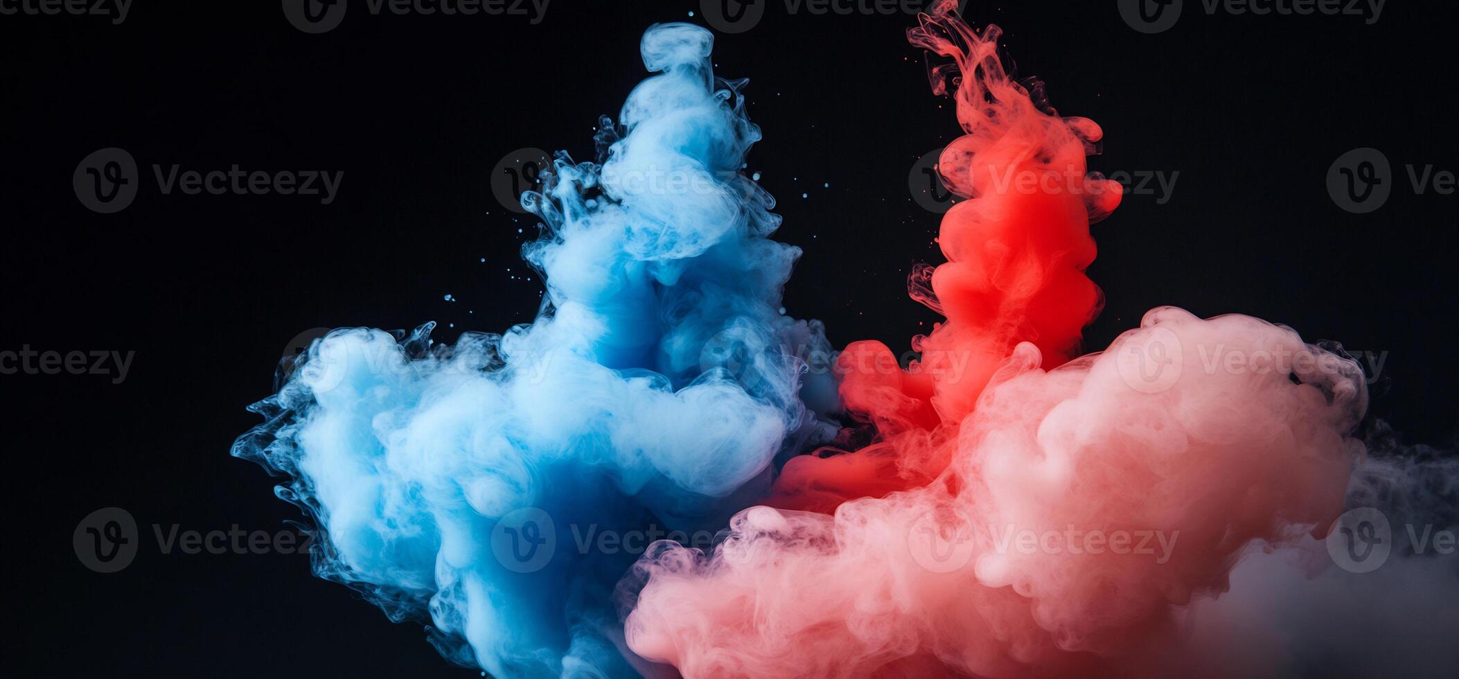 Abstract blue and red ink swirling in water. photo