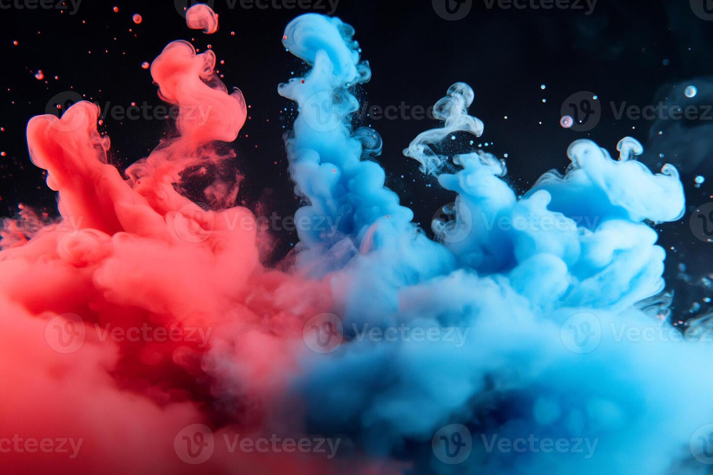 Colorful ink in water on black background photo