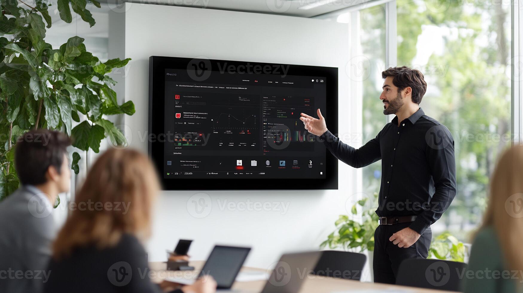 Businessman presenting data on a large screen to colleagues in a modern office. photo