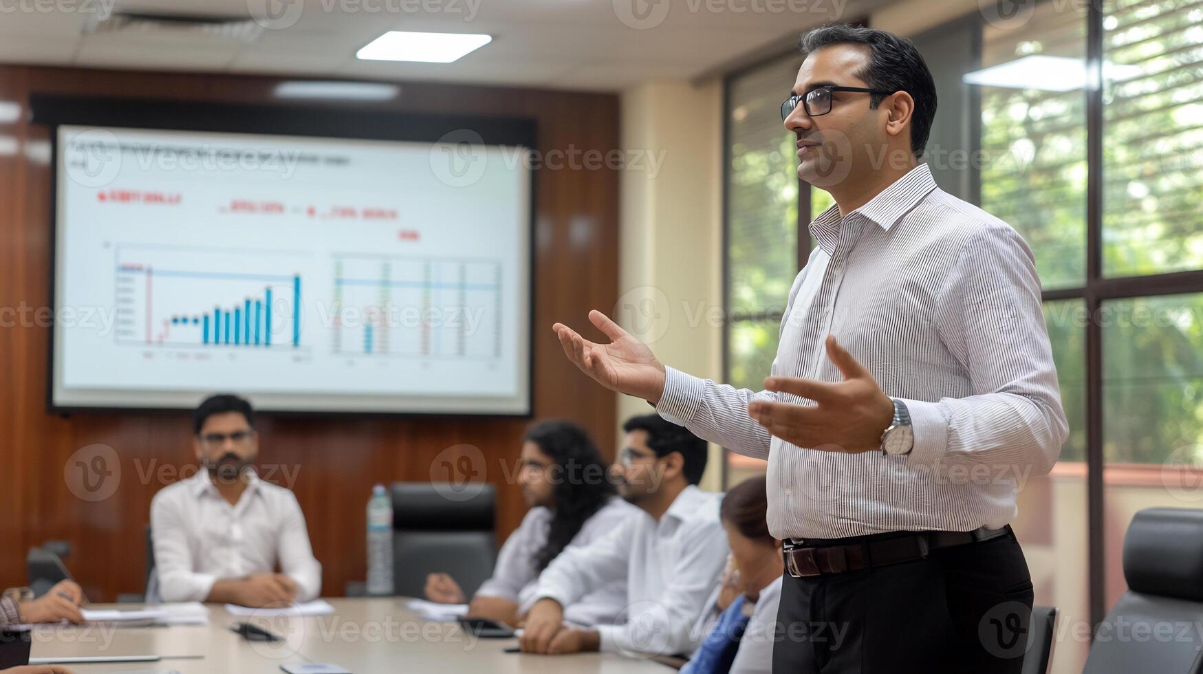 Businessman giving presentation in conference room. photo