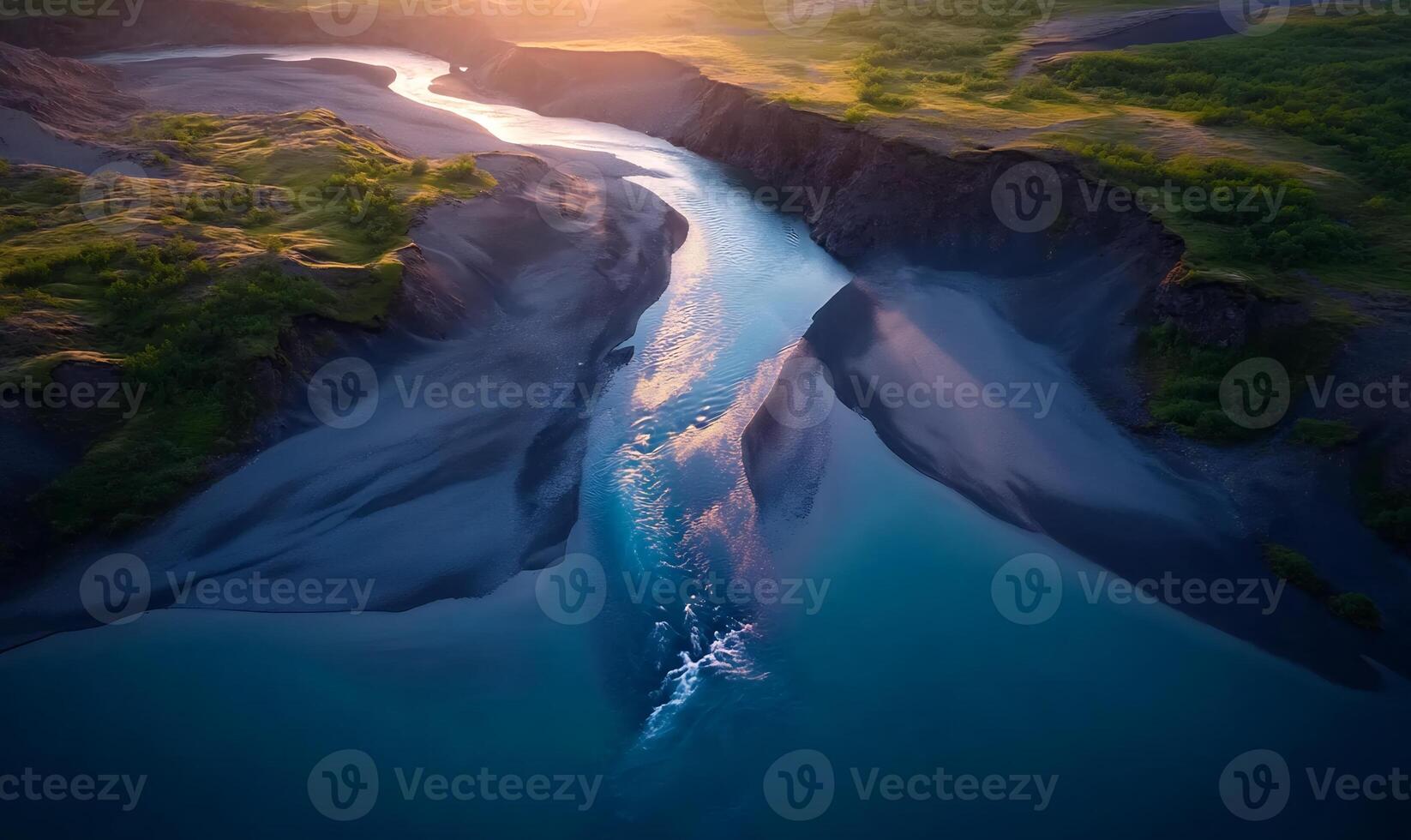 Aerial view of a river splitting into two channels at sunset. photo