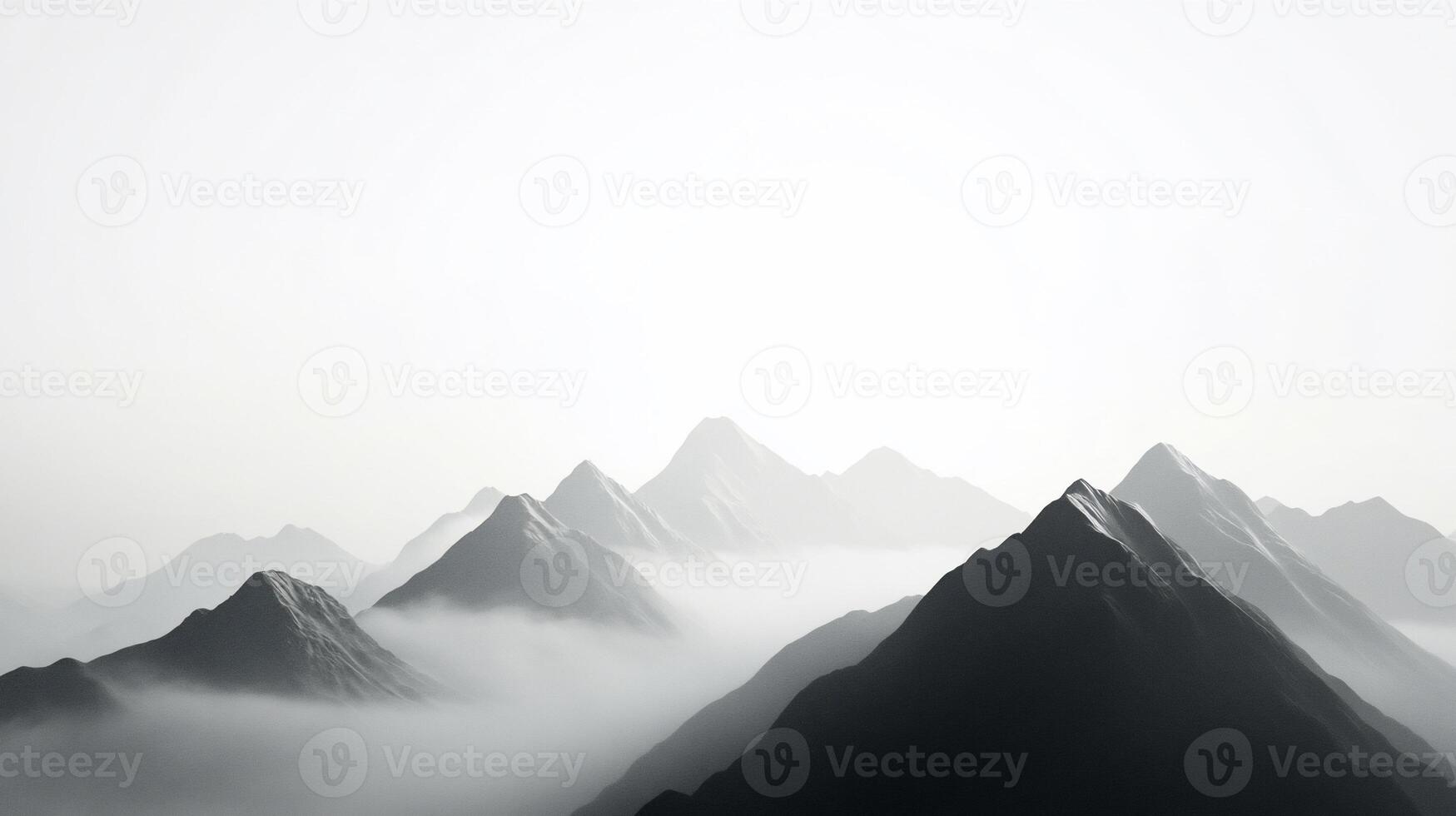 Monochromatic mountain range shrouded in mist. photo
