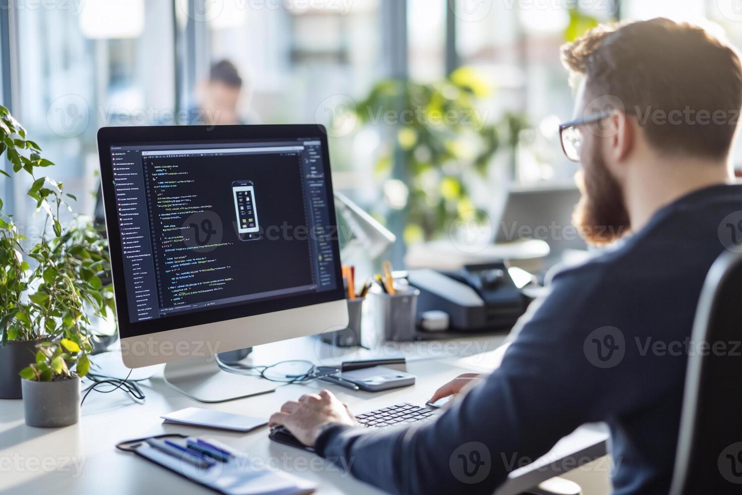 Programmer coding app on desktop computer. photo