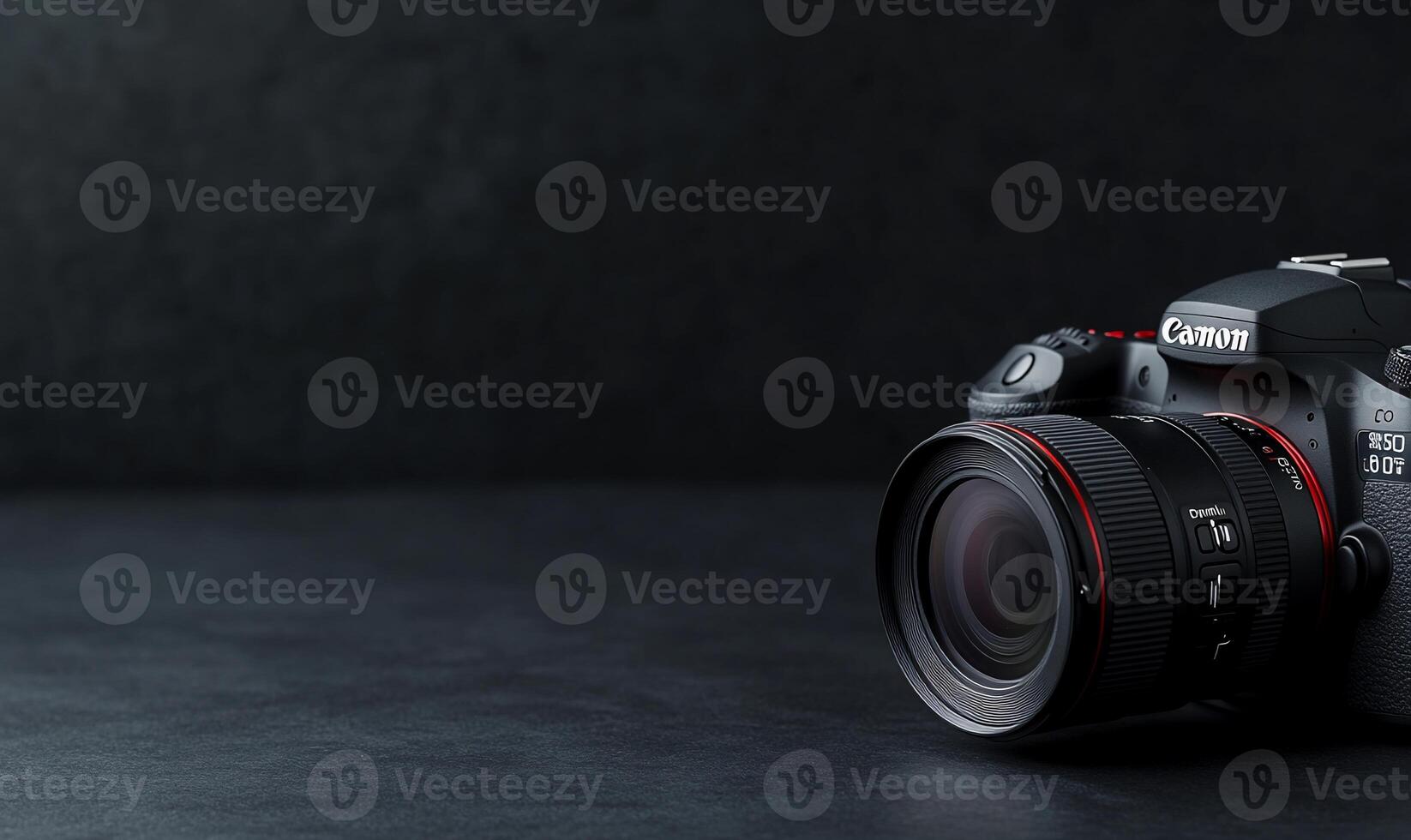 DSLR camera with lens on dark surface. photo