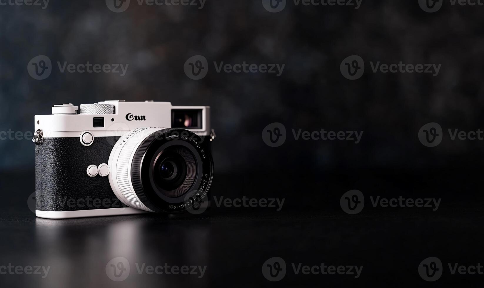 Stylish white and black rangefinder camera on dark background. photo