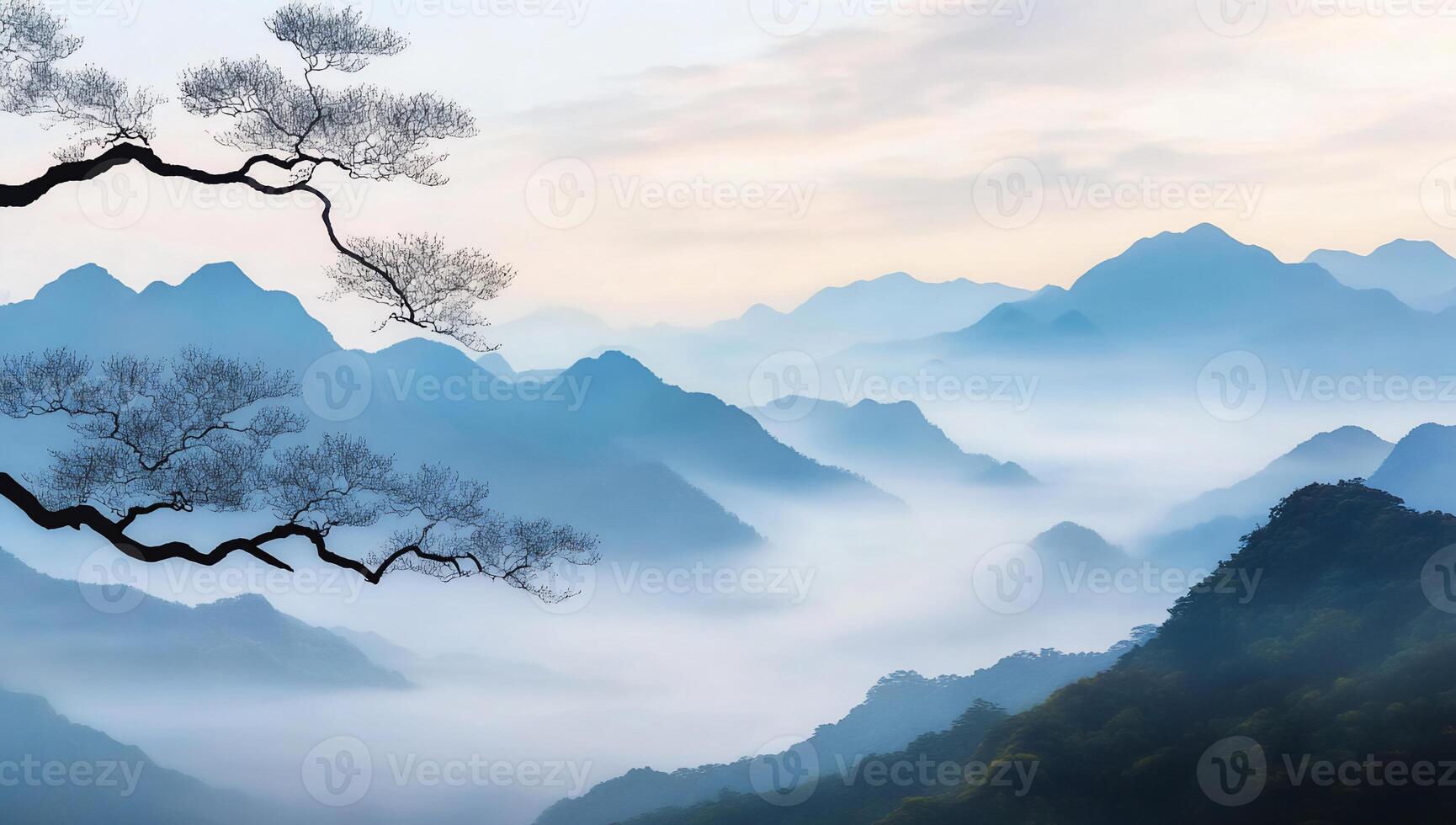 Misty mountain landscape with a silhouetted tree branch. photo