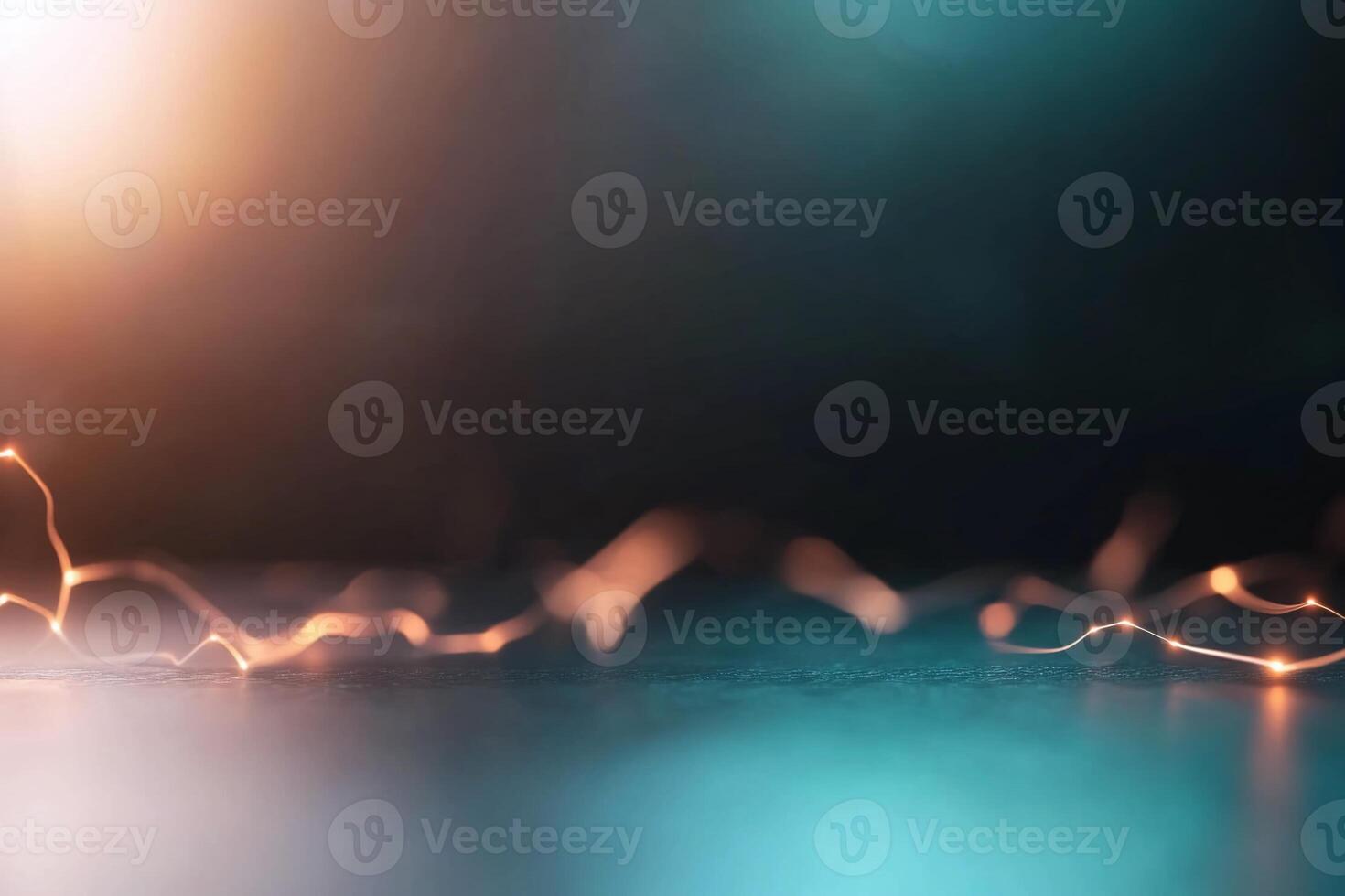Abstract dark background with glowing orange and teal lights. photo