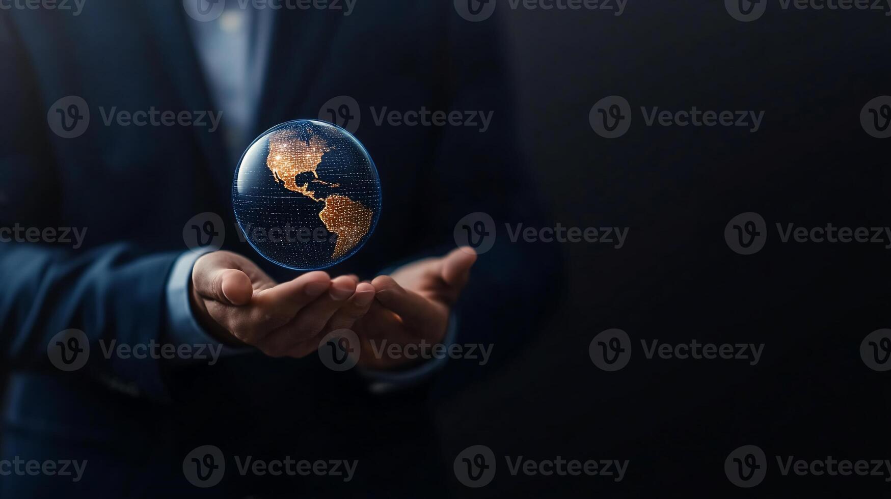 Businessman holding a transparent globe. photo