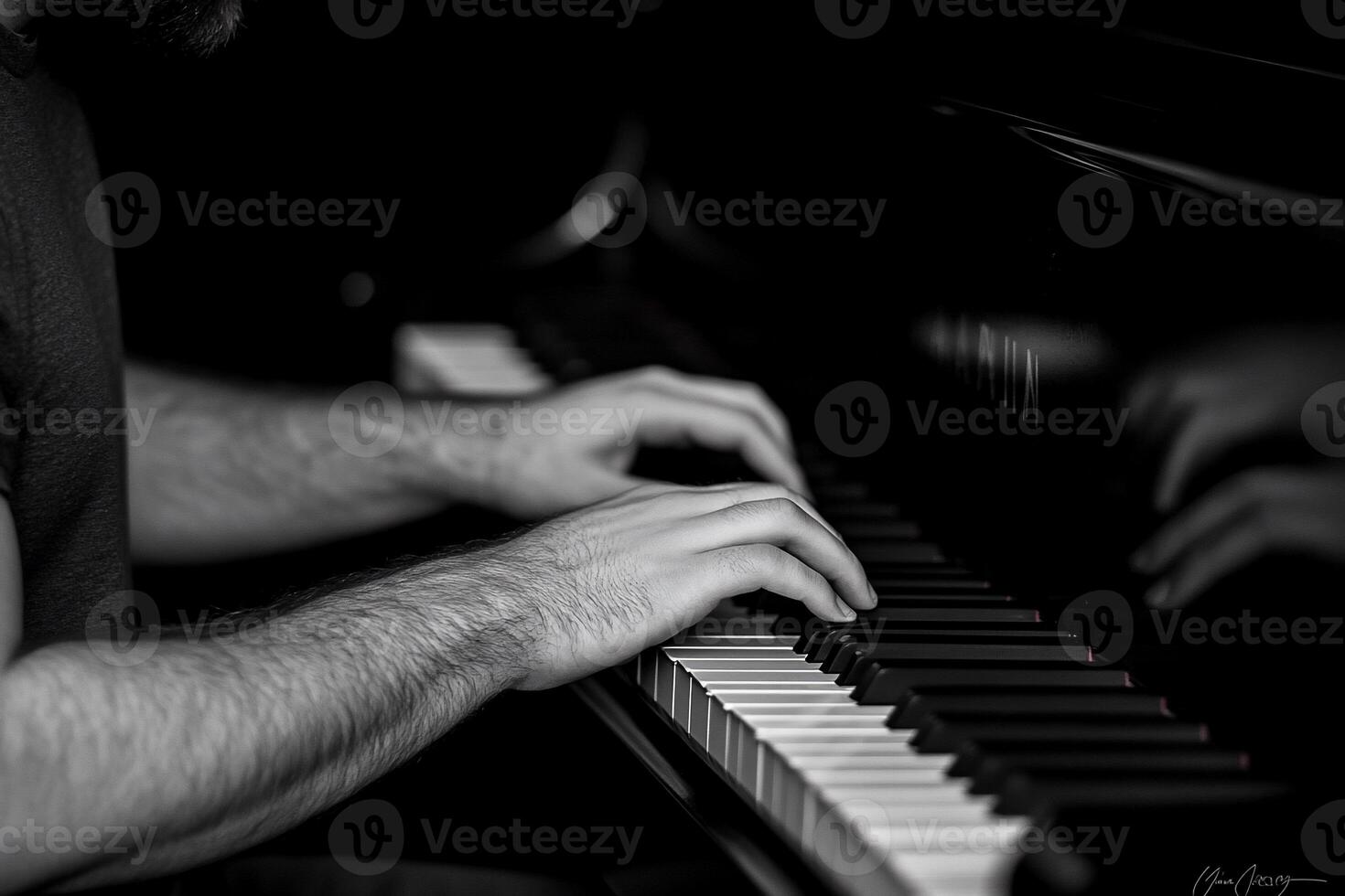 Close-up of man's hands playing piano. photo