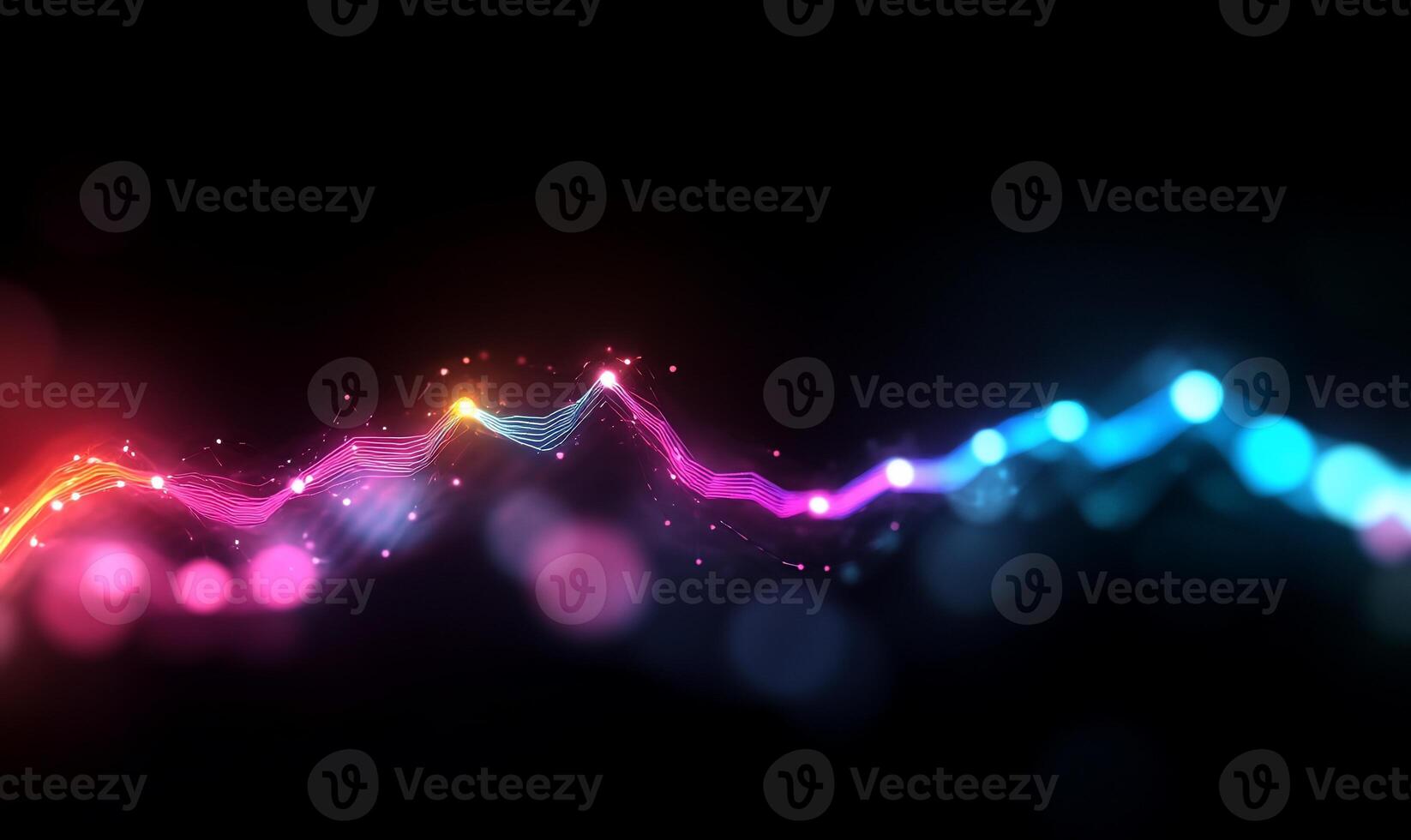 Abstract glowing wave with pink and blue particles on black background. photo