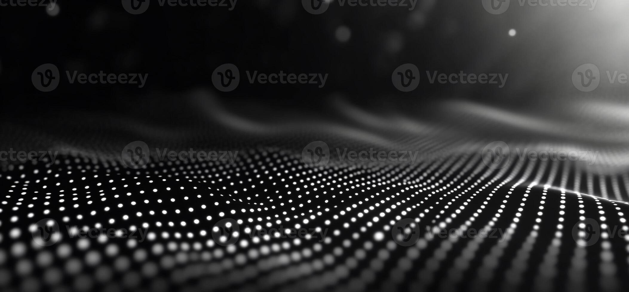 Abstract grayscale wave of glowing dots. photo