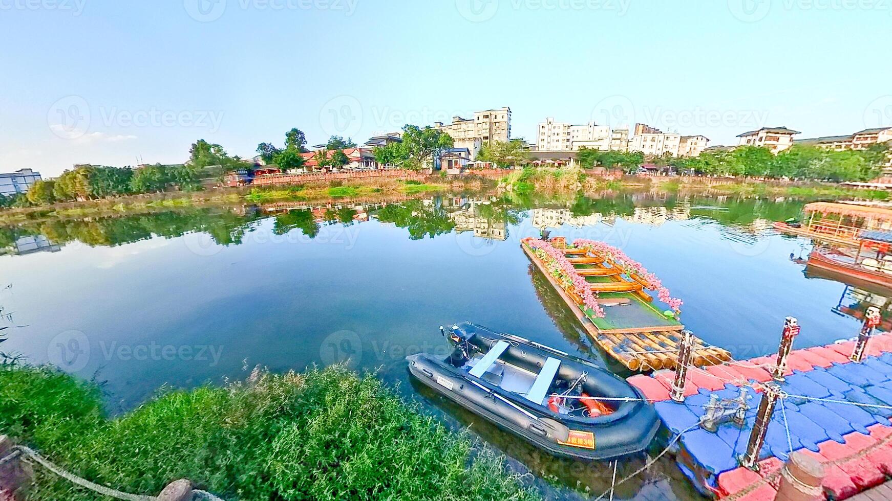 a boat is docked on the water next to a house photo