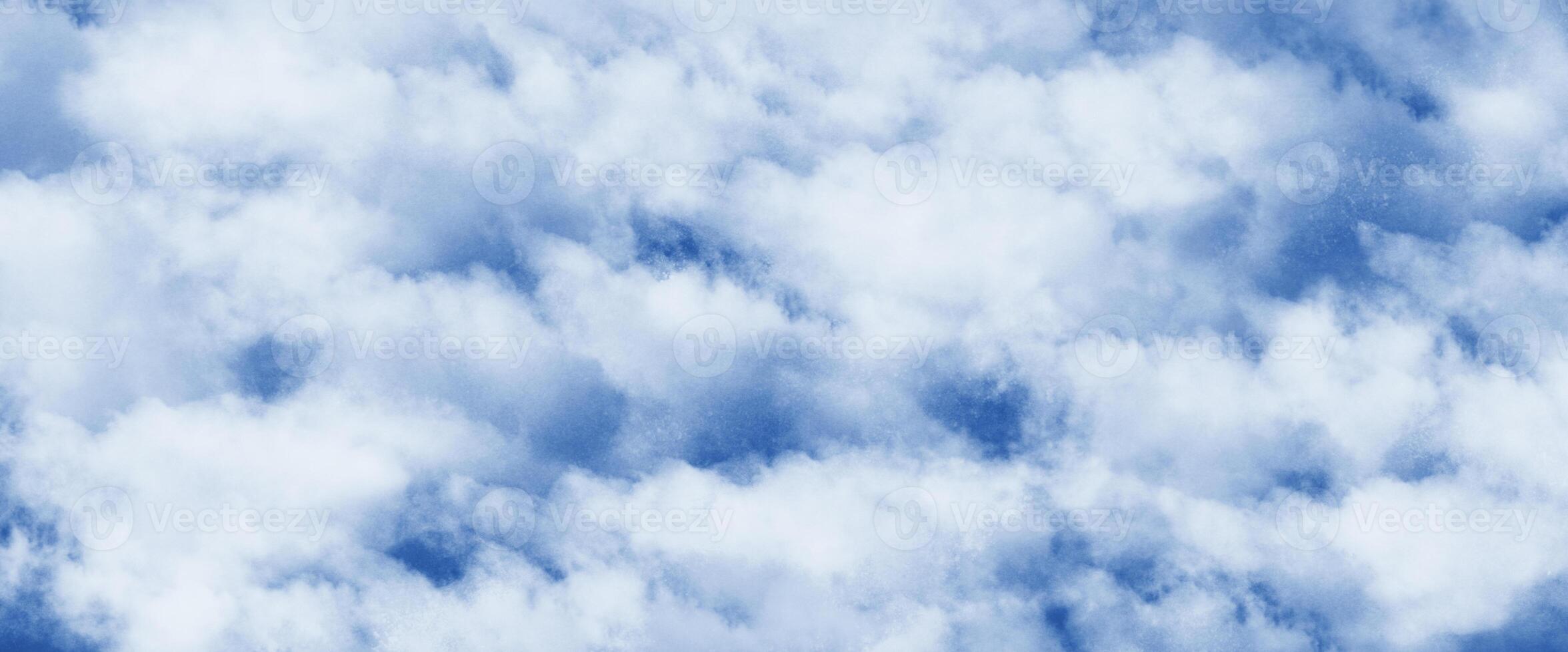 Fluffy White Clouds in a Blue Sky photo