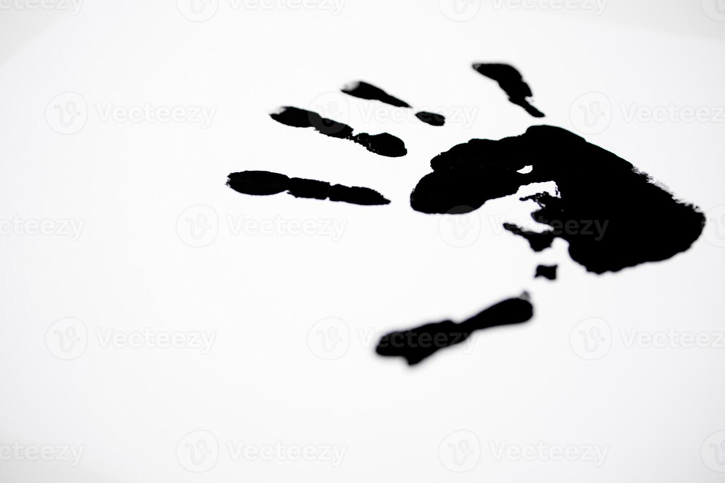 Black handprint on white background symbolizing creativity and expression photo