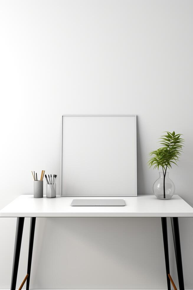 White desk with a blank picture frame and a plant photo