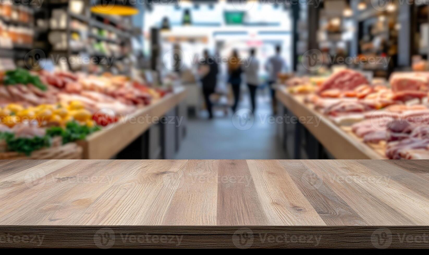 A wooden countertop in a bustling market filled with fresh produce. photo