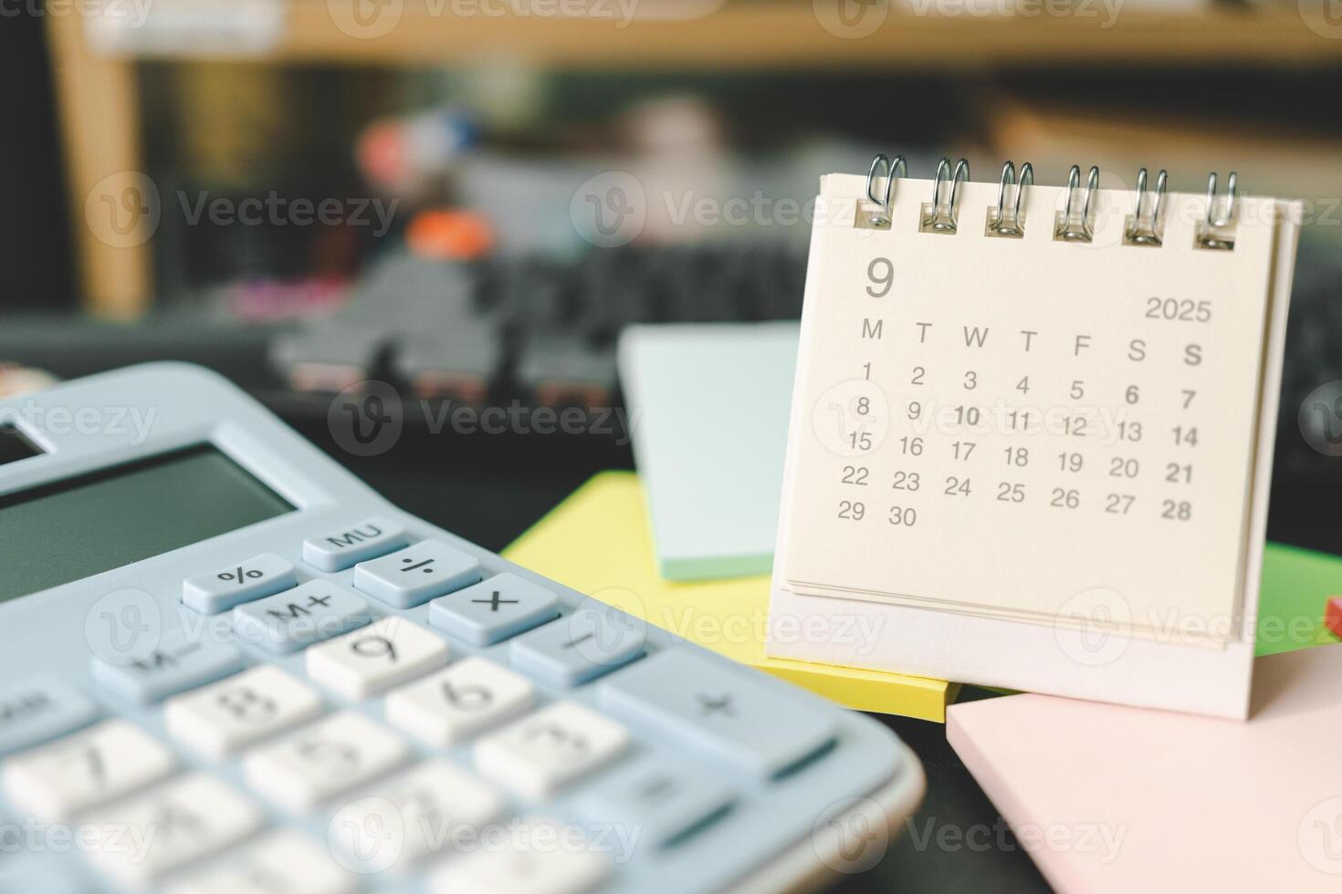 Desk calendar for SEPTEMBER 2025 with Sticky note. Calendar concept with 2025 SEP calendar. calculator and forecast for finances in 2025. Money, Budget, tax, investment and financial. photo