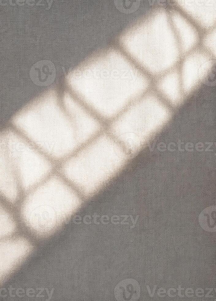 Sunlight through the blinds on a linen background. Copy space. Light and Shadow Grid photo