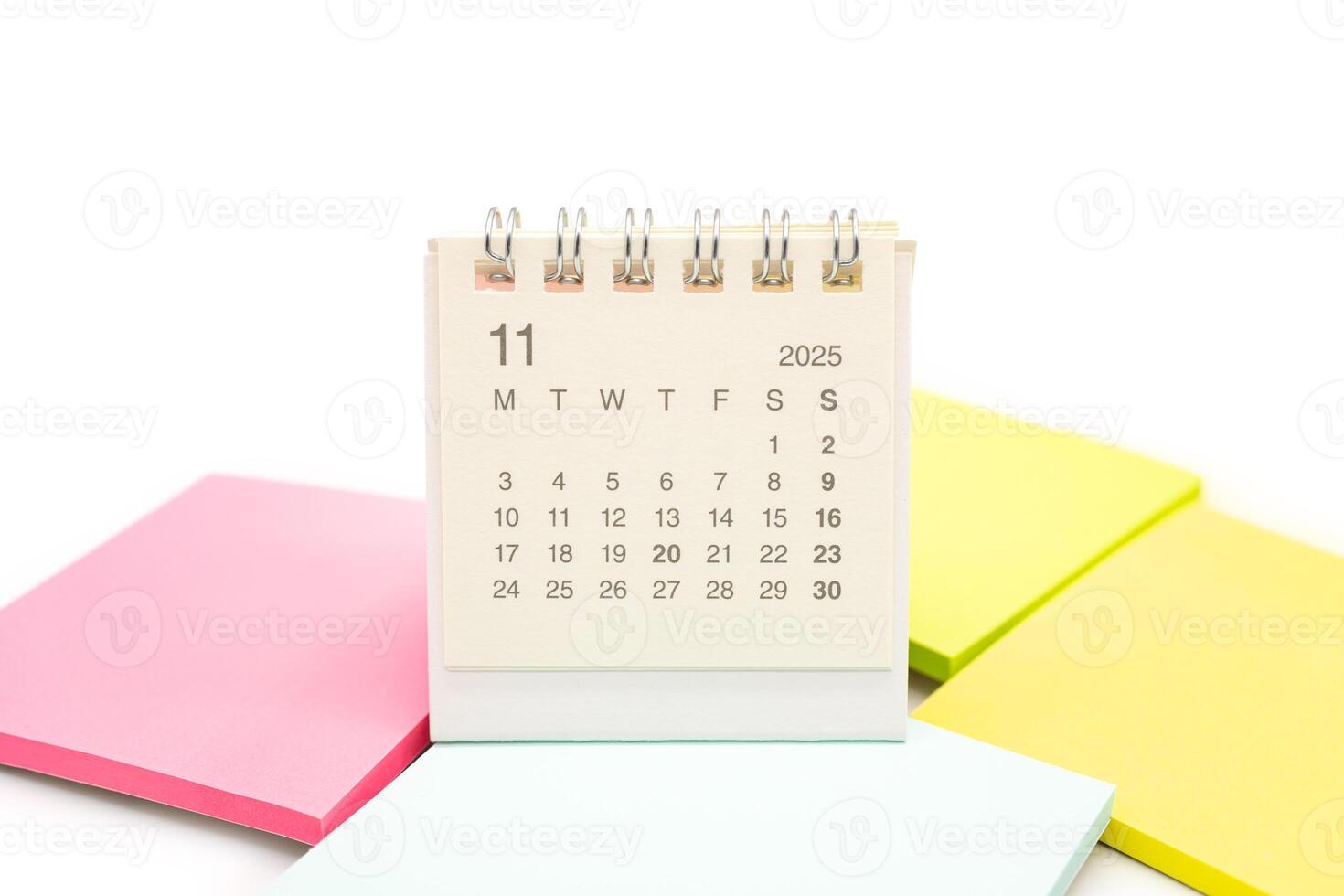 Mini Desk Calendar for NOVEMBER 2025 background. Calendar concept with 2025 NOV calendar. Sticky note. isolated on white background. photo