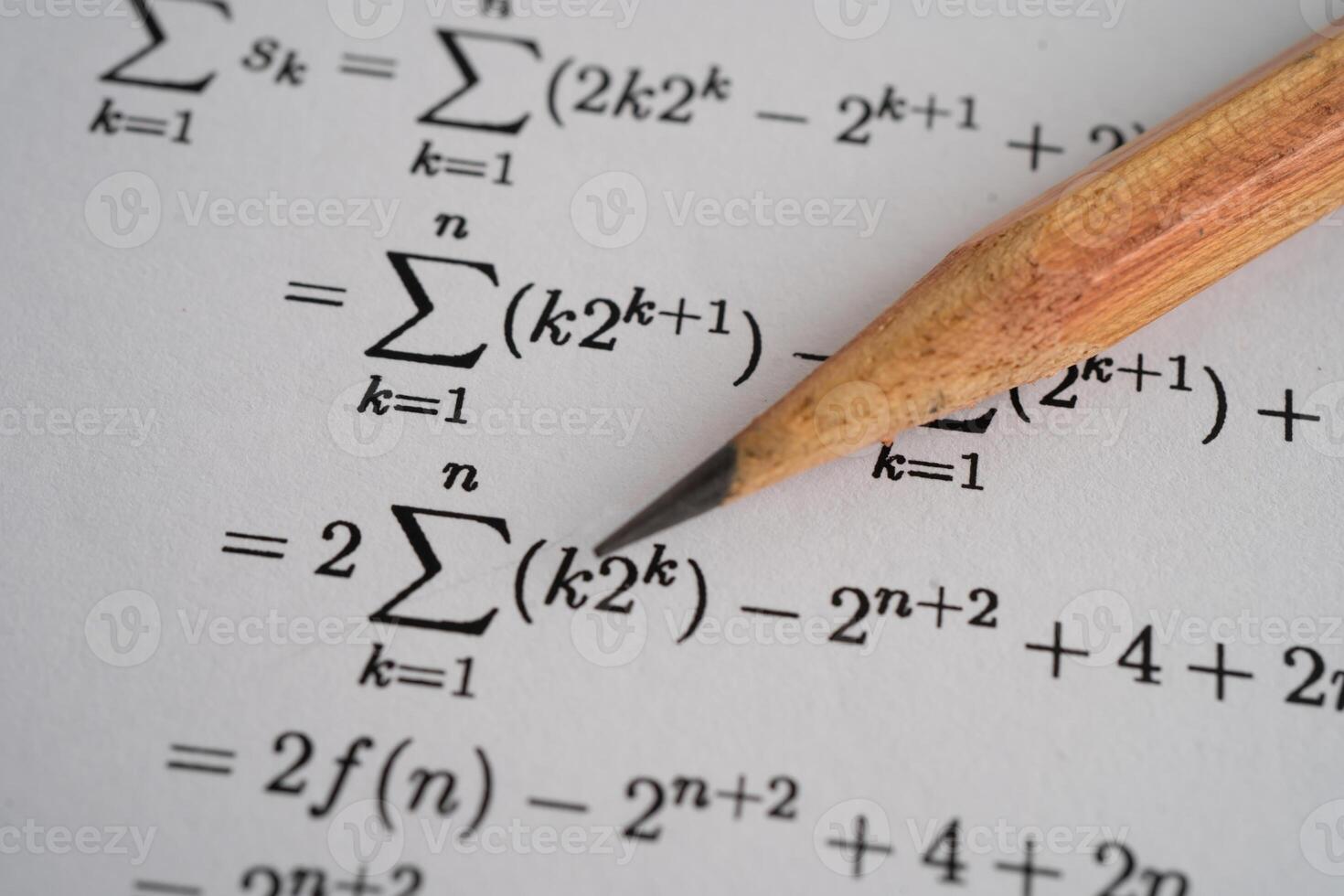 Pencil on mathematic formula exercise test paper photo