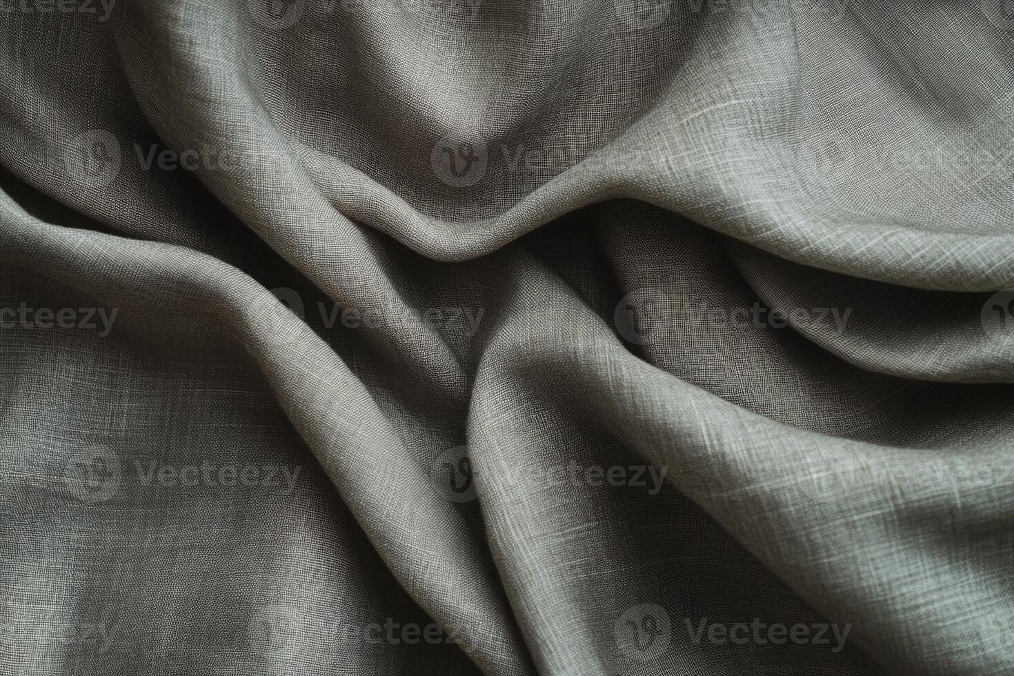 Closeup of Textured Grey Fabric Folds with Soft Light for Textile and Design Applications photo