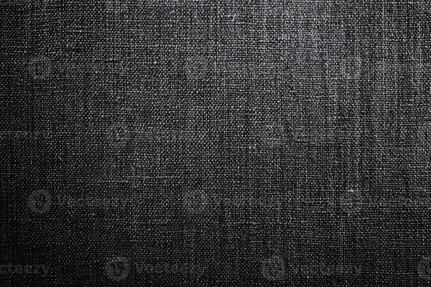 Dark Textured Black Fabric Material Closeup for Background Design or Wallpaper Use photo