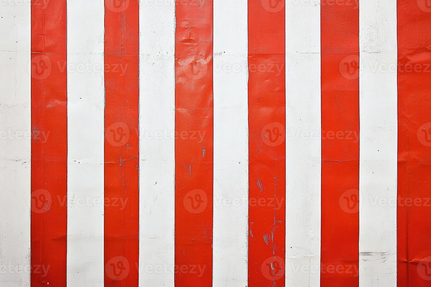 Red and White Vertical Striped Pattern on a Textured Wall with Subtle Wear Marks photo
