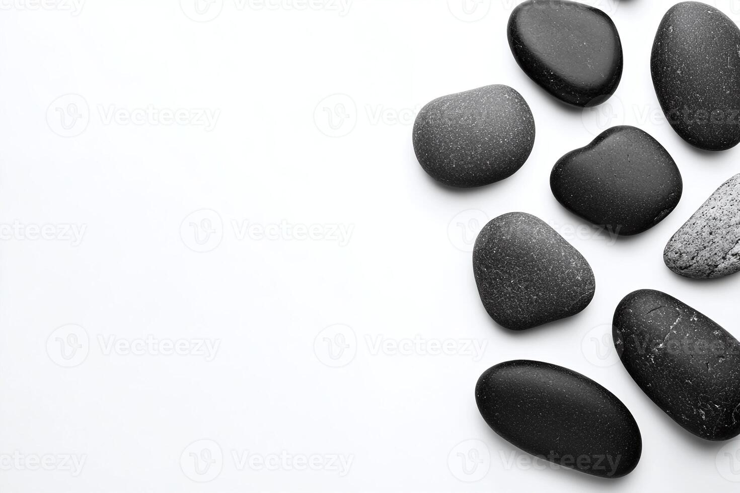 Black Smooth Spa Stones Arranged on White Minimalist Background for Relaxation and Balance Concept photo