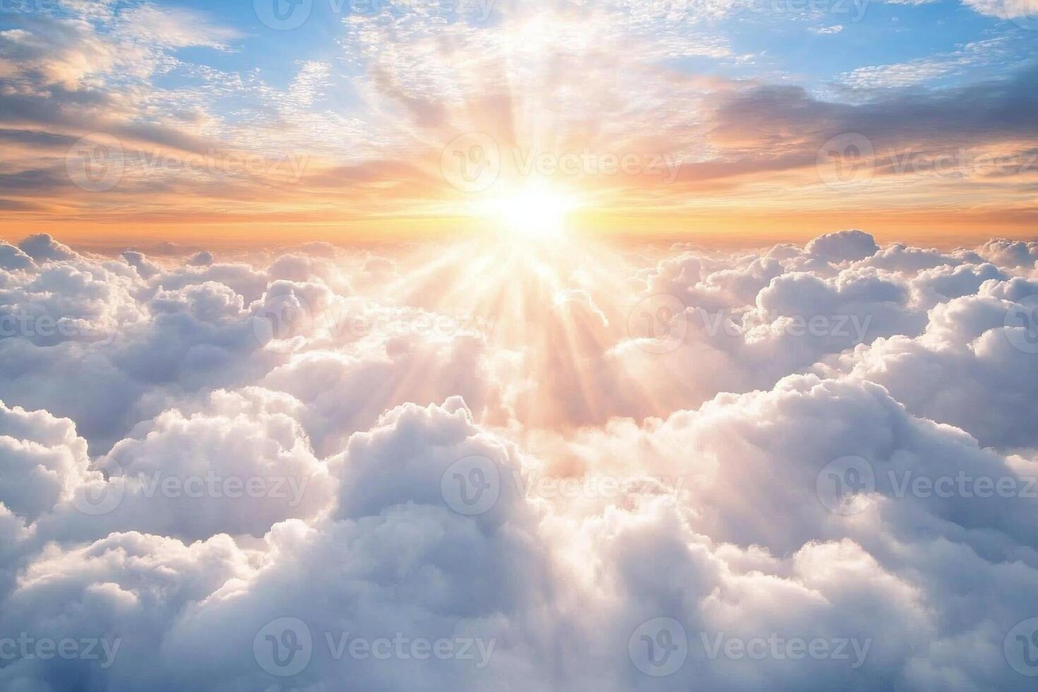 Sunlight Rays Breaking Through Fluffy White Clouds in Vibrant Blue Sky at Sunrise Atmospheric Beauty photo