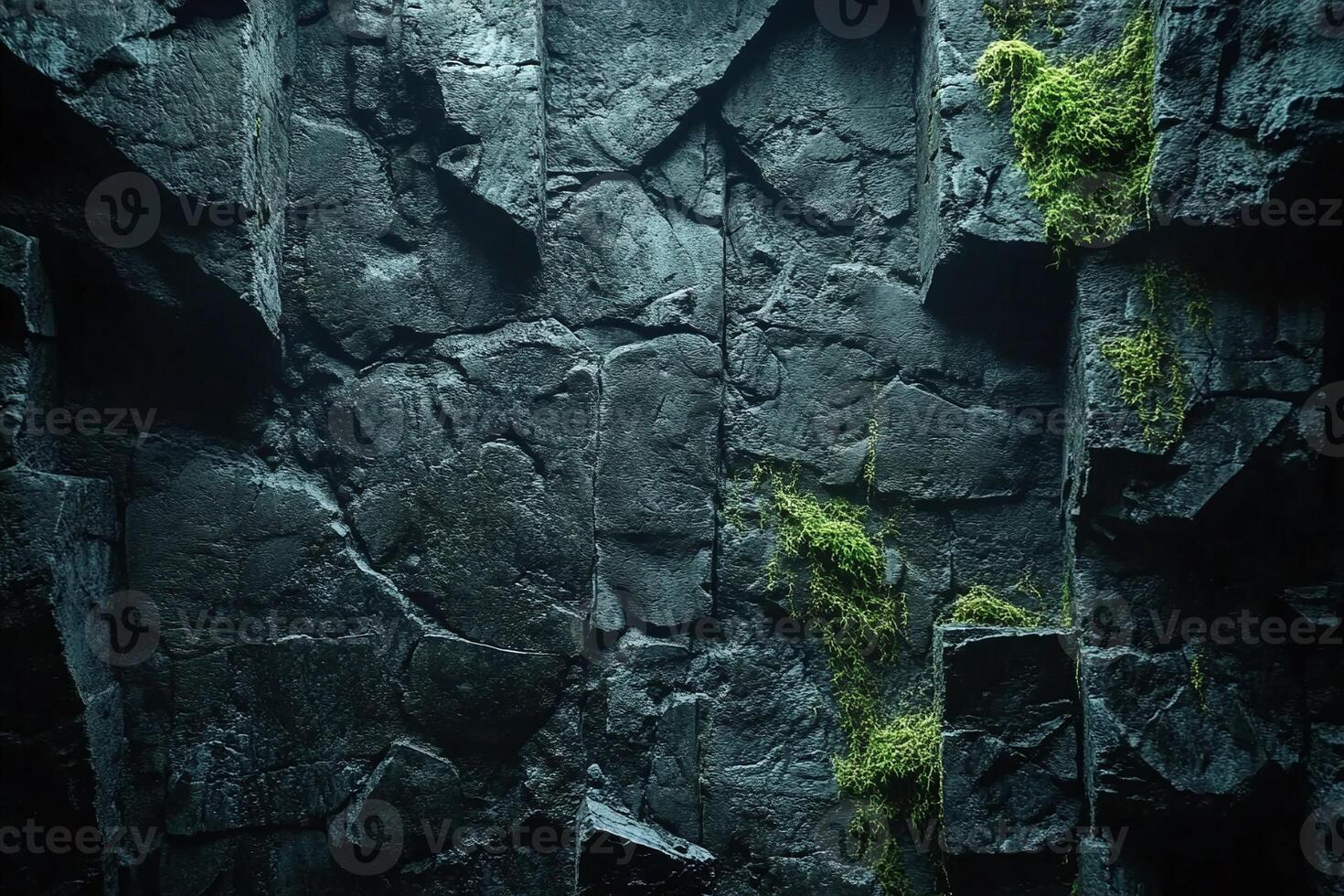 Dark Textured Rocky Wall with Green Moss Growth and Natural Stone Details for Background Design photo