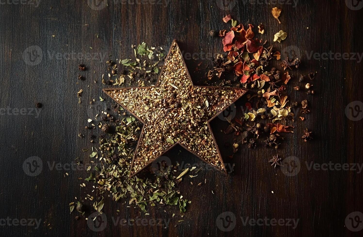 Rustic Star Shaped Spice Arrangement with Herbs and Dried Flowers on Dark Wooden Surface photo