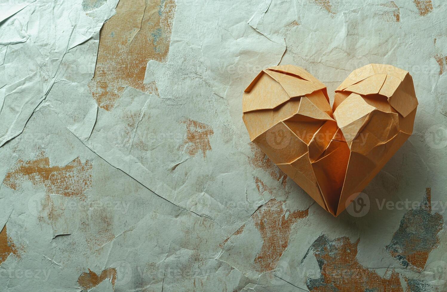 Orange Origami Heart on Textured Beige and Brown Paper Background for Love and Creativity Themes photo