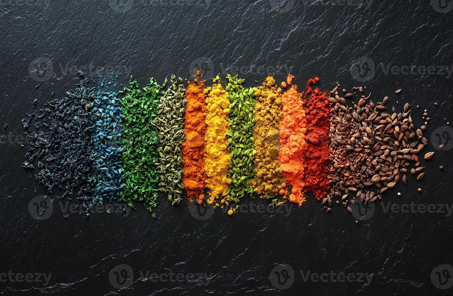 Vibrant Assortment of Colorful Spices and Seeds Arranged on a Black Slate Background for Culinary Inspiration photo