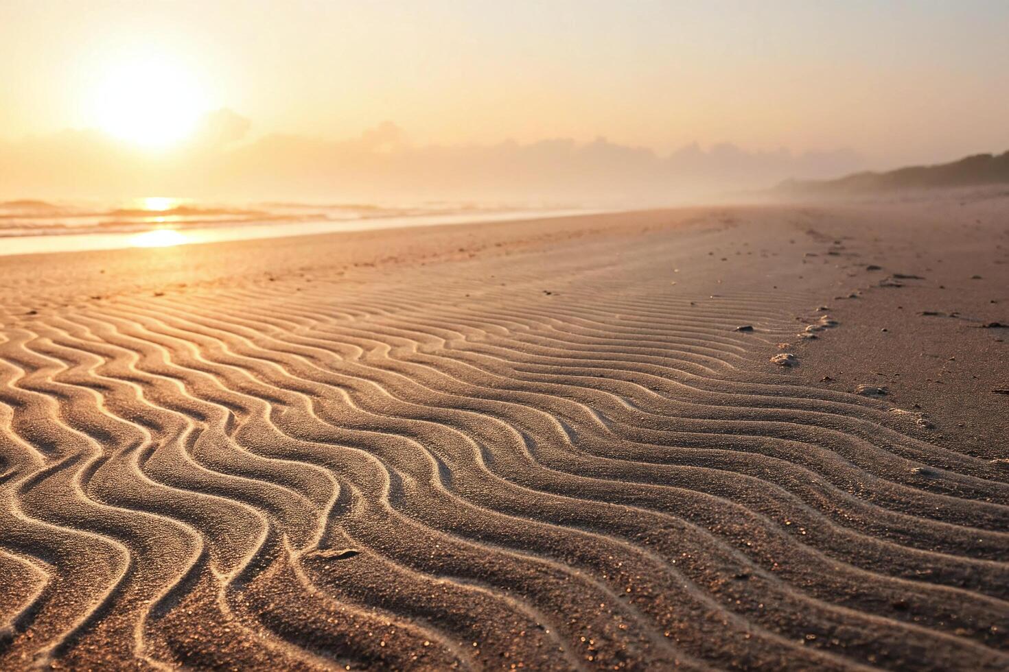 Sunset on the beach with waves and sand photo