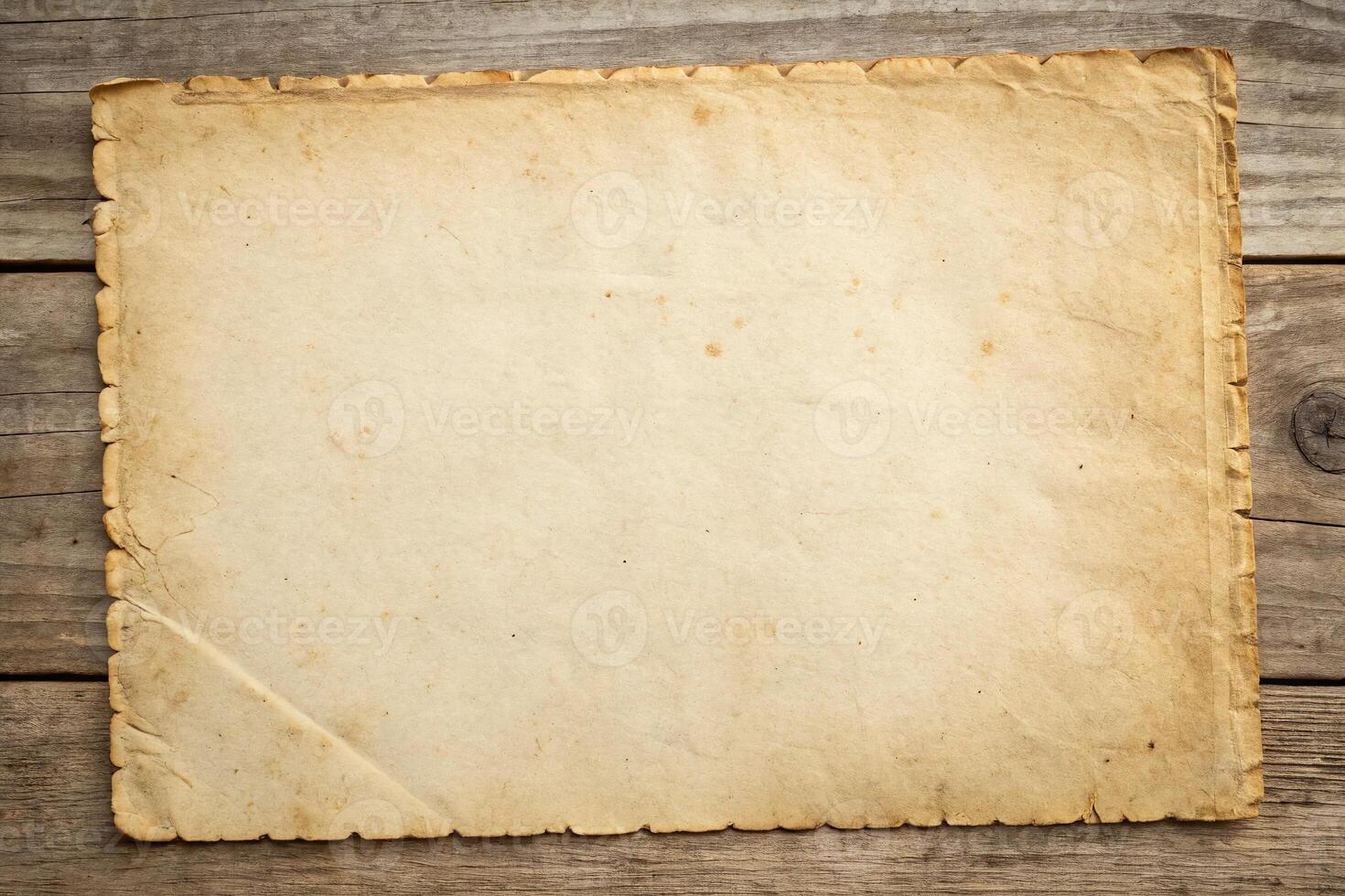 Old paper on wooden background photo