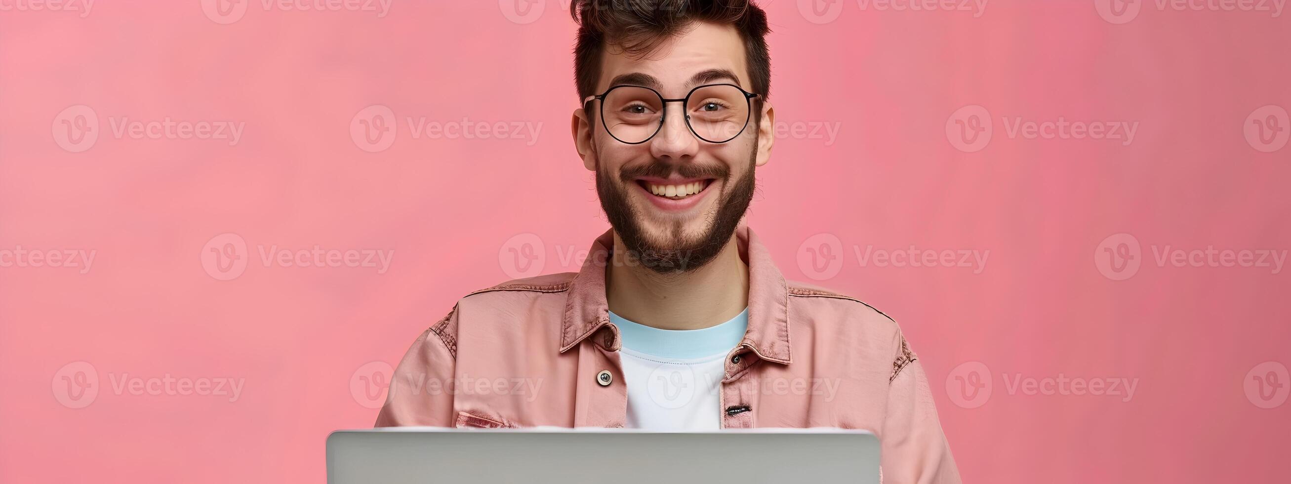 Happy Young Content Creator Exuding Joy and Success while Working on a Colorful Digital Design photo