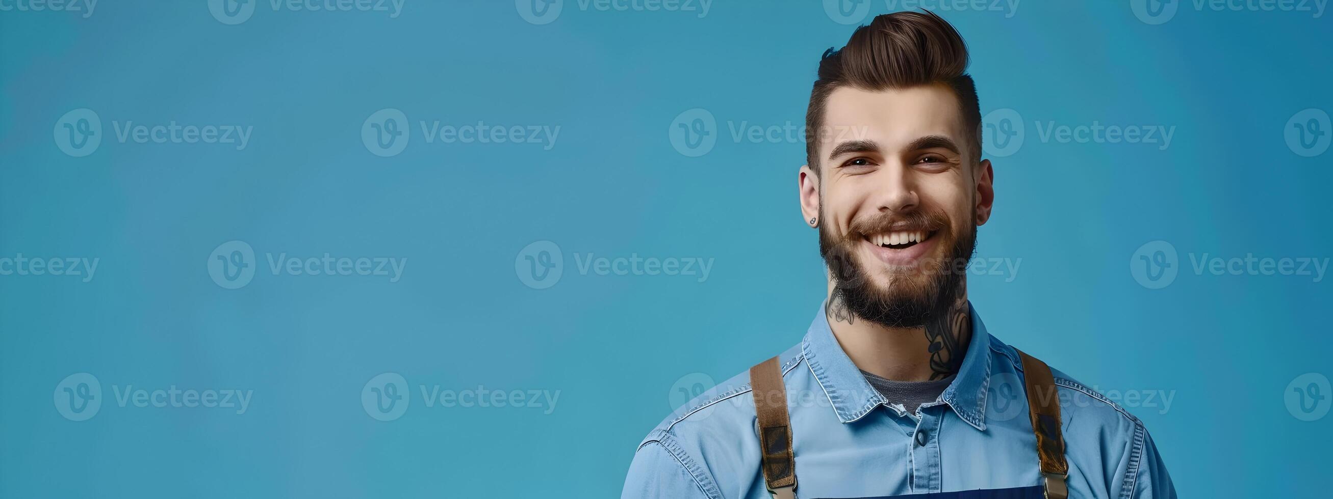 Happy Young Mechanic Exuding Pride and Success in Vibrant Workspace photo