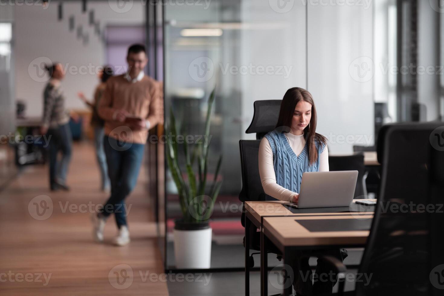 Senior bearded businessman, IT professional, trader, and crypto investor using a digital tablet in a modern coworking space. Tech-savvy professional working in an open office startup environment photo