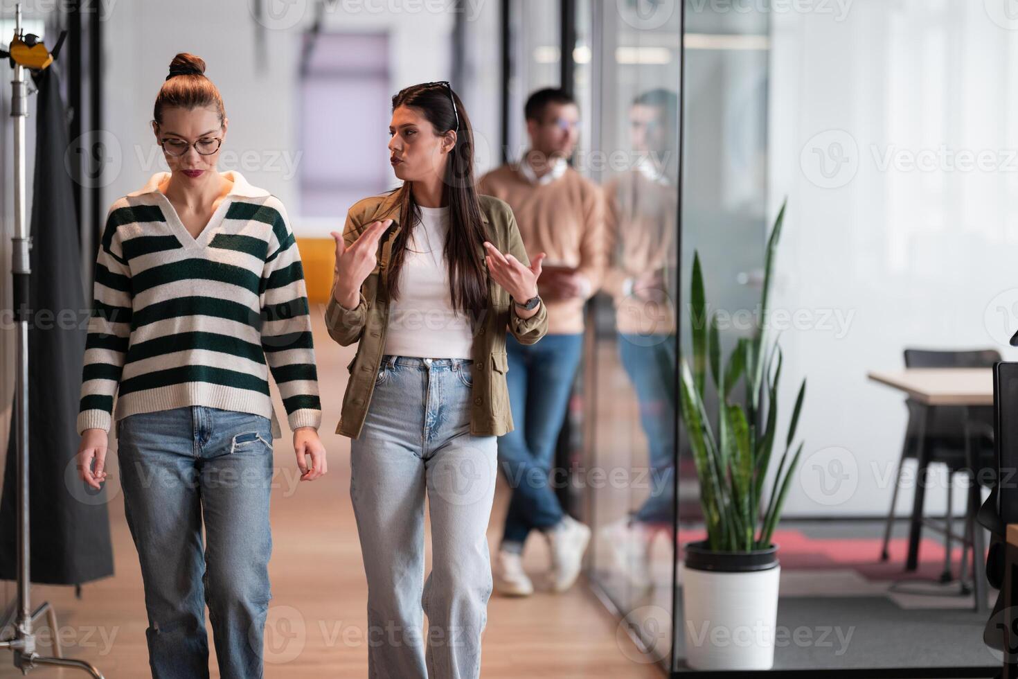 Senior bearded businessman, IT professional, trader, and crypto investor using a digital tablet in a modern coworking space. Tech-savvy professional working in an open office startup environment photo