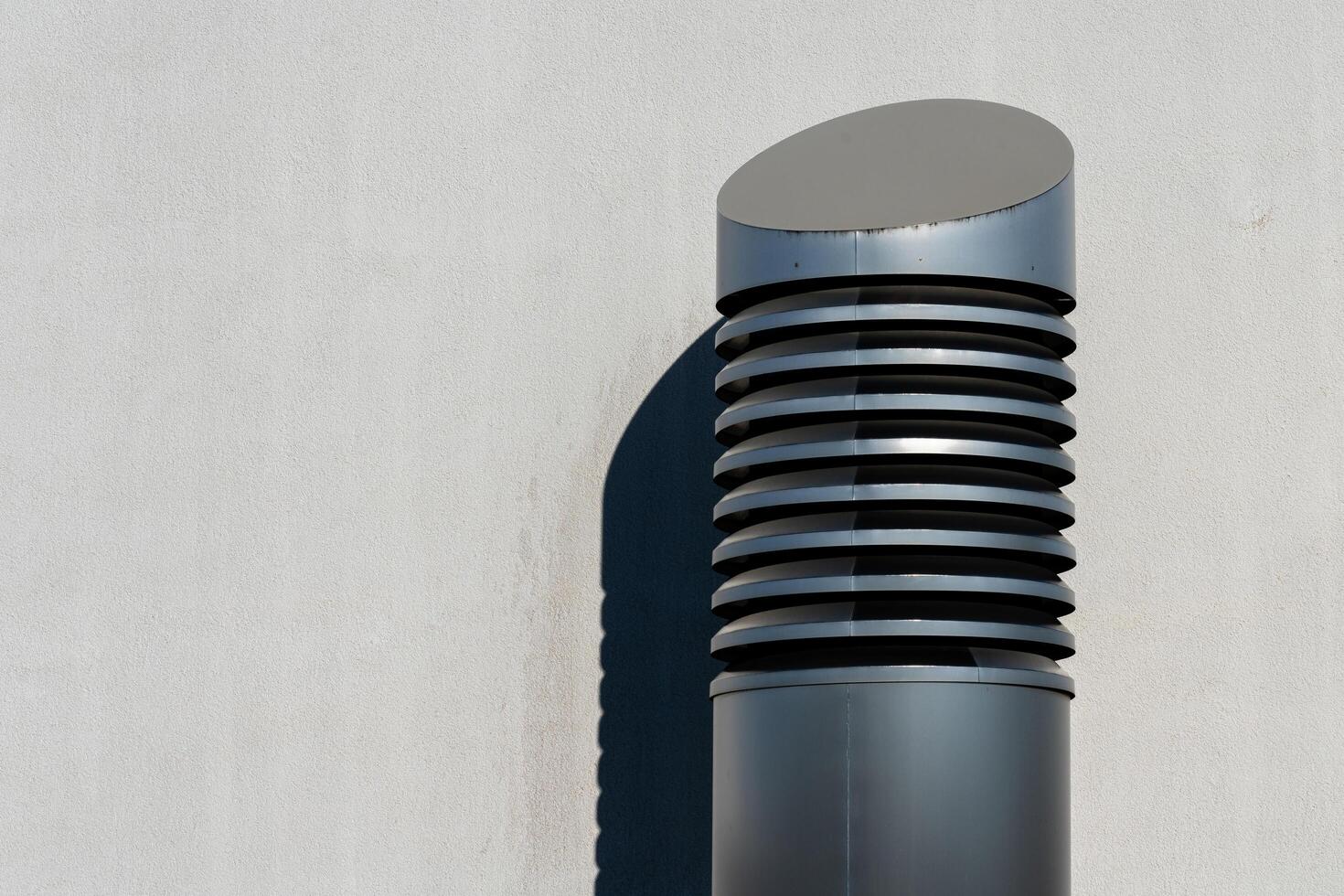 Unique architectural detail featuring a modern vent on a wall photo