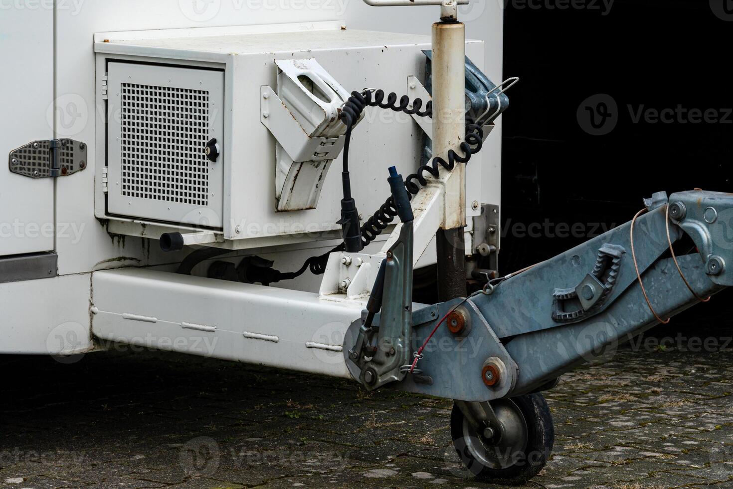 Trailer coupling and electrical connections in parking area photo