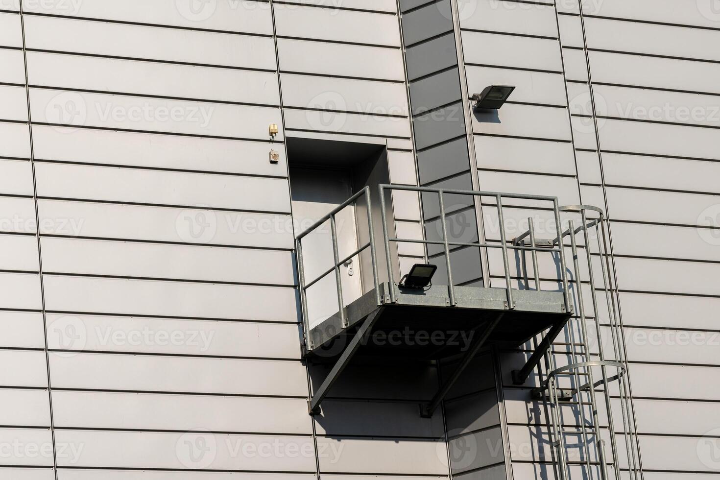Balcony with safety railing on modern building exterior photo