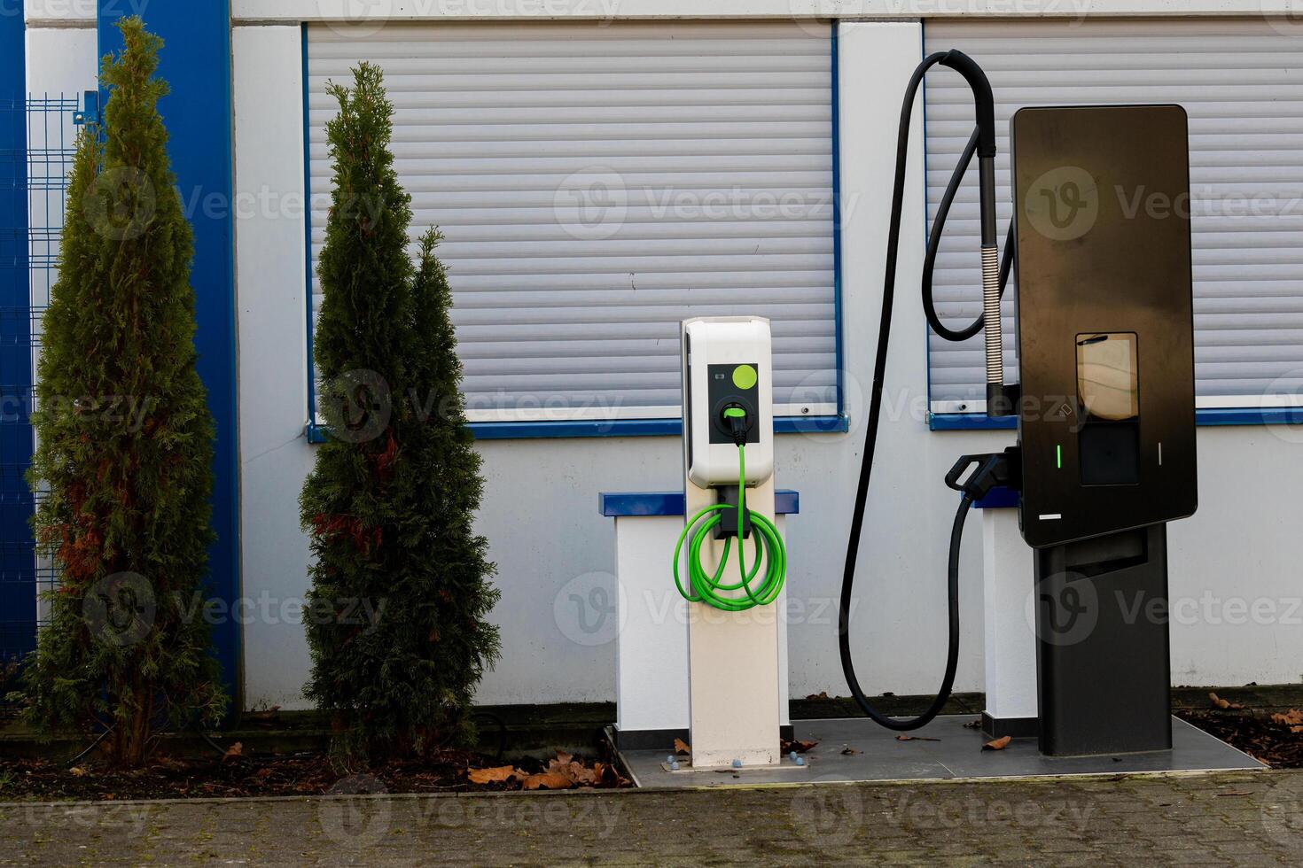 Electric vehicle charging station located near a modern building photo